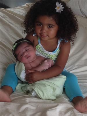 Emelia holding Naya 2014
